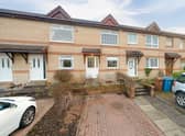 For Sale: Well-presented and stylish mid-terrace house with private parking and a garden listed for £100,000