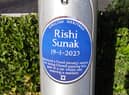 The 'blue plaque' commemorating Rishi Sunak's Fixed Penalty on Squires Gate Lane, Blackpool.