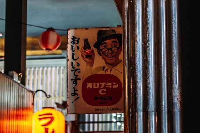A selection of vintage enamel signs and light boxes have been imported all the way from Japan