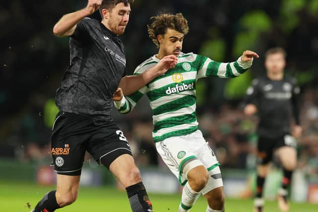 Jota of Celtic is challenged by Declan Gallagher of St Mirren 