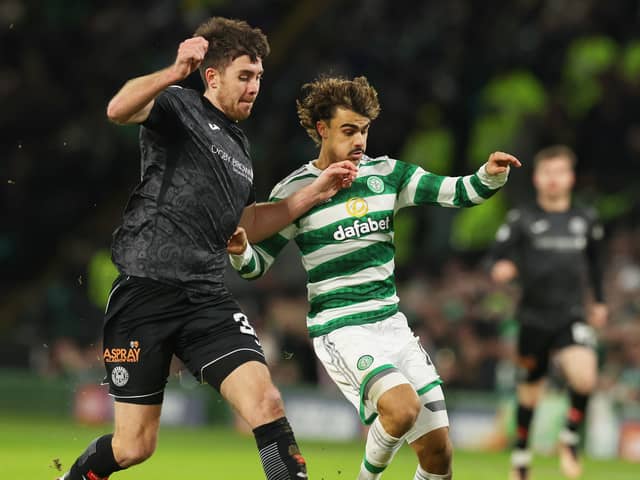 Jota of Celtic is challenged by Declan Gallagher of St Mirren 
