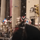 Harrison Ford pictured on horseback during the Indiana Jones trailer at the cross between Renfield Street and Saint Vincent Street