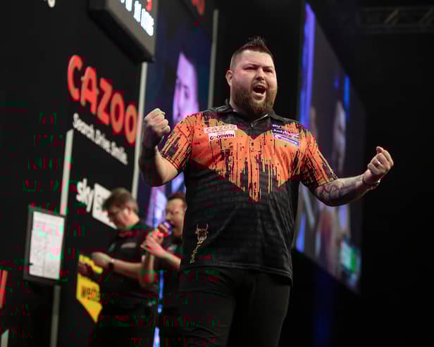 Michael Smith celebrates his victory on Night Three of the Premier League Darts in Glasgow (Image: Taylor Lanning/PDC)