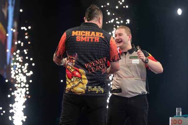 Michael Smith is congratulated by Dimitri Van den Bergh after beating the Belgian 6-4 in the final at the OVO Hydro (Image: Taylor Lanning/PDC)