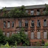 The overgrown, boarded up remains of Golfhill Public School