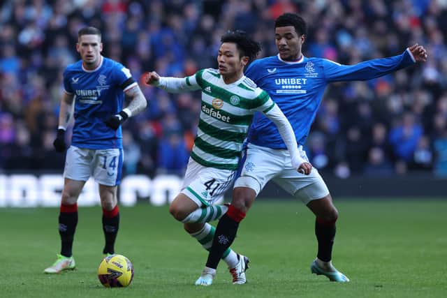 Reo Hatate of Celtic vies with Malik Tillman of Rangers during an Old Firm clash on January 2
