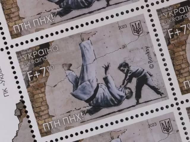 Ukraine postage stamps depicting a Banksy mural