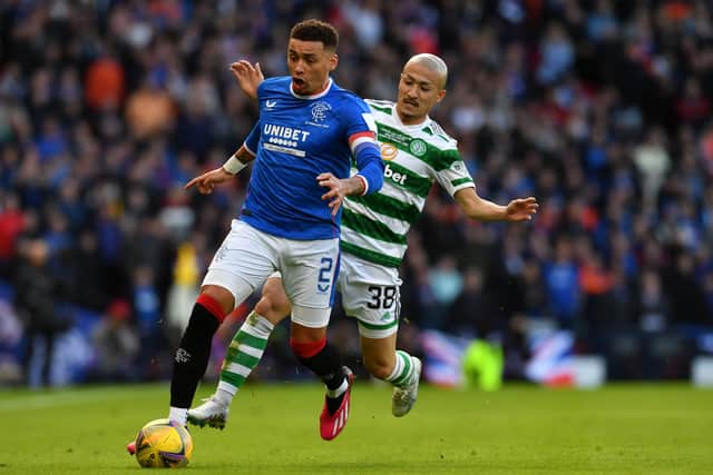 ames Tavernier of Rangers runs with the ball while under pressure from Daizen Maeda of Celtic