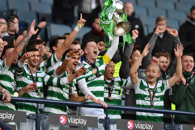 Celtic captain Callum McGregor lifts the trophy