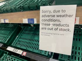 Empty shelves are seen in the fruit and vegetable aisles of a Tesco supermarket on February 22 in Burgess Hill.