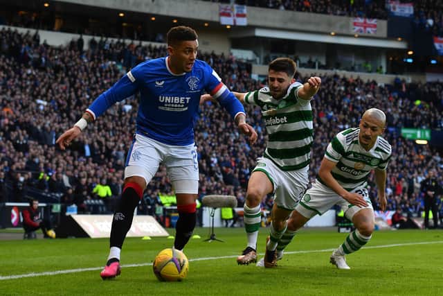 James Tavernier of Rangers is put under pressure by Greg Taylor and Daizen Maeda of Celtic 