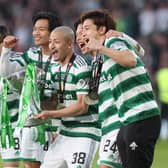 Celtic’s Japanese contingent Kyogo Furuhashi, Reo Hatate, Daizen Maeda, Yuki Kobayashi and Tomoki Iwata pose with the Viaplay Cup trophy