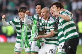 Celtic’s Japanese contingent Kyogo Furuhashi, Reo Hatate, Daizen Maeda, Yuki Kobayashi and Tomoki Iwata pose with the Viaplay Cup trophy