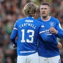 John Lundstram of Rangers embraces teammate Todd Cantwell following the team's defeat