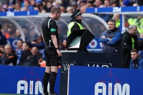 Referee Willie Collum consults VAR before awarding Rangers a penalty