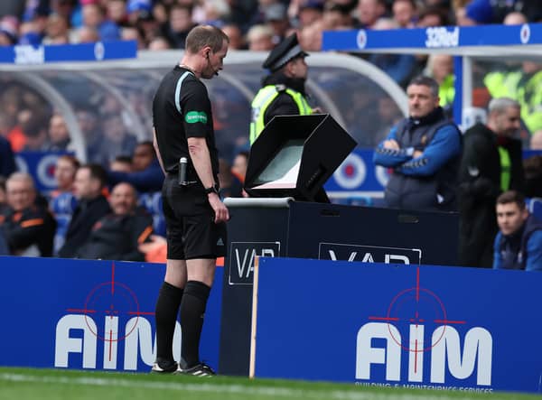 Referee Willie Collum consults VAR before awarding Rangers a penalty