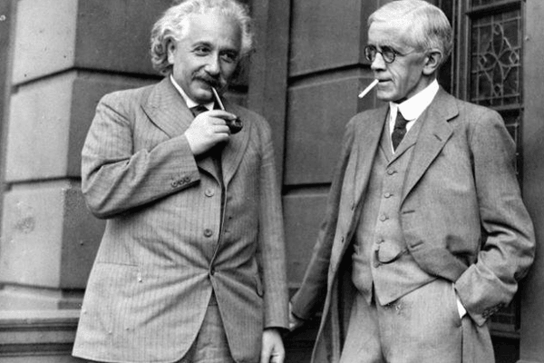 Einstein enjoying a toot on the old pipe with Archibald Young, Professor of Surgery at the University of Glasgow.