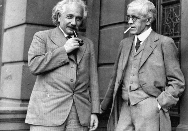 Einstein enjoying a toot on the old pipe with Archibald Young, Professor of Surgery at the University of Glasgow.