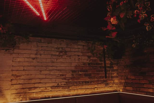 The neon-lit interior of West End Wendy’s on Byres Road