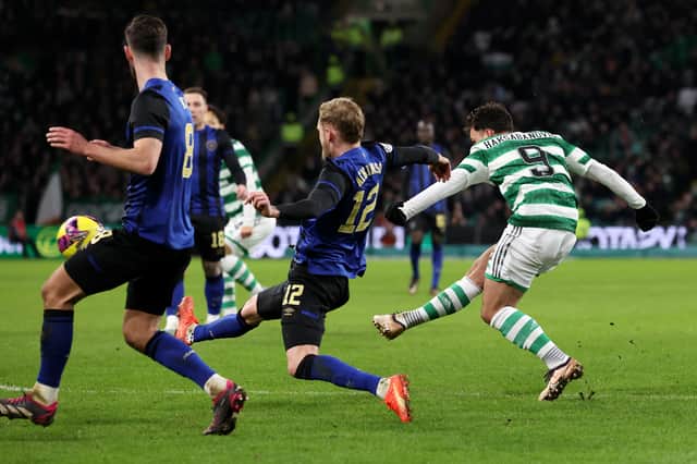 Sead Haksabanovic of Celtic curls home a stunning third goal against Hearts
