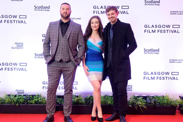 The cast of Winnie the Pooh: Blood and Honey on the Red carpet for the UK premiere of the film at Glasgow Film Festival for Fright Fest at Glasgow Film Theatre. From left to right: Craig-David Dowsett, Amber Doig-Thorne, and Nikolai Leon