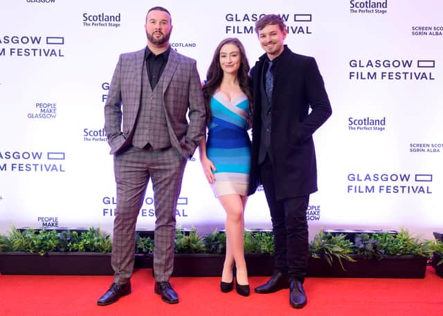 The cast of Winnie the Pooh: Blood and Honey on the Red carpet for the UK premiere of the film at Glasgow Film Festival for Fright Fest at Glasgow Film Theatre. From left to right: Craig-David Dowsett, Amber Doig-Thorne, and Nikolai Leon