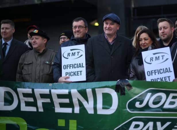 RMT general secretary Mick Lynch (centre) on an RMT picket line during January’s strike (Photo by DANIEL LEAL/AFP via Getty Images)