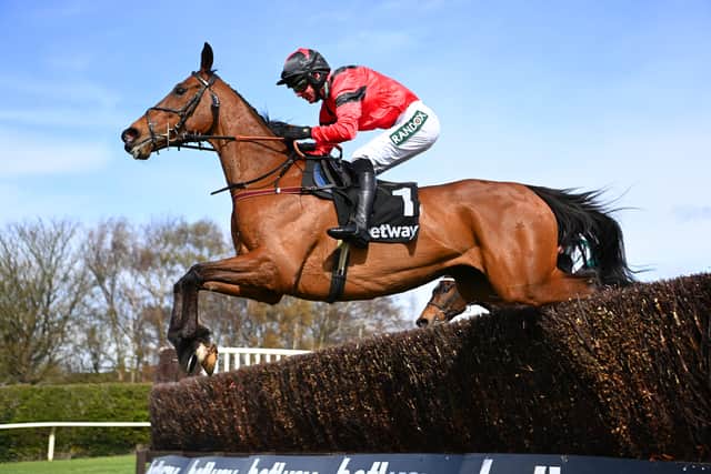 Derek Fox on Ahoy Senor clear a fence in the Betway Mildmay Novices’ Chase race during Ladies’ Day at Aintree in 2022