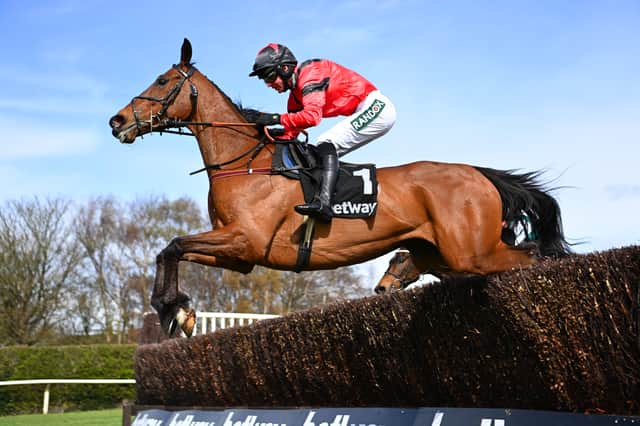 Derek Fox on Ahoy Senor clear a fence in the Betway Mildmay Novices’ Chase race during Ladies’ Day at Aintree in 2022
