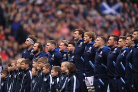 The Scotland team sing the national anthem during a Six Nations Rugby match at Murrayfield Stadium