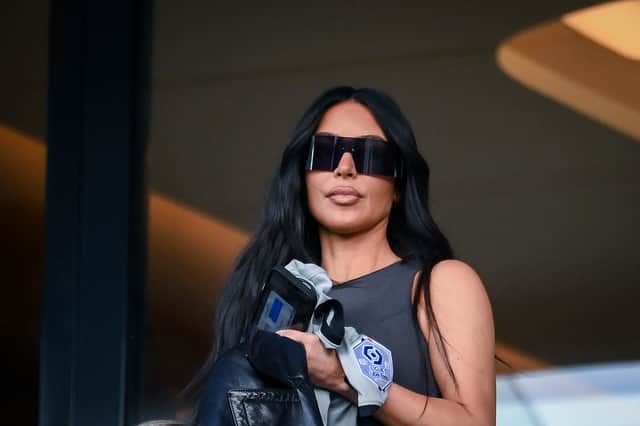 TOPSHOT - US socialite Kim Kardashian attends to watch the French L1 football match between Paris Saint-Germain (PSG) and Stade Rennais FC at The Parc des Princes Stadium in Paris on March 19, 2023. (Photo by FRANCK FIFE / AFP) (Photo by FRANCK FIFE/AFP via Getty Images)