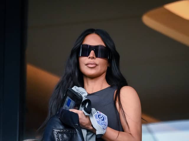 TOPSHOT - US socialite Kim Kardashian attends to watch the French L1 football match between Paris Saint-Germain (PSG) and Stade Rennais FC at The Parc des Princes Stadium in Paris on March 19, 2023. (Photo by FRANCK FIFE / AFP) (Photo by FRANCK FIFE/AFP via Getty Images)