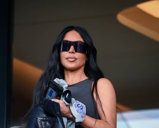 TOPSHOT - US socialite Kim Kardashian attends to watch the French L1 football match between Paris Saint-Germain (PSG) and Stade Rennais FC at The Parc des Princes Stadium in Paris on March 19, 2023. (Photo by FRANCK FIFE / AFP) (Photo by FRANCK FIFE/AFP via Getty Images)