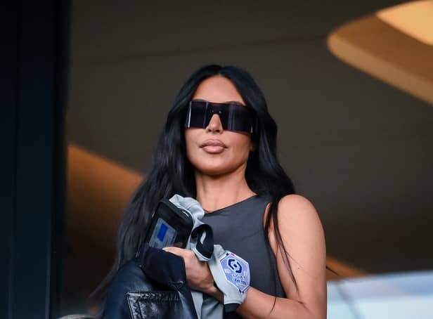 TOPSHOT - US socialite Kim Kardashian attends to watch the French L1 football match between Paris Saint-Germain (PSG) and Stade Rennais FC at The Parc des Princes Stadium in Paris on March 19, 2023. (Photo by FRANCK FIFE / AFP) (Photo by FRANCK FIFE/AFP via Getty Images)