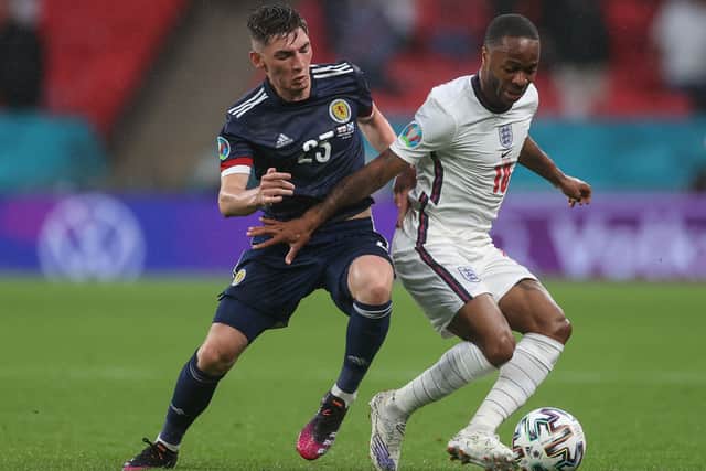 Scotland’s midfielder Billy Gilmour (L) fights for the ball with England’s forward Raheem Sterling at Wembley