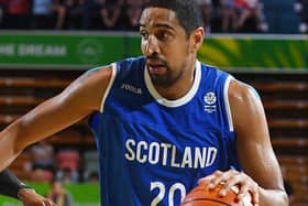 Kieron Achara of Scotland drives to the basket past Kofi Josephs of England in 2018