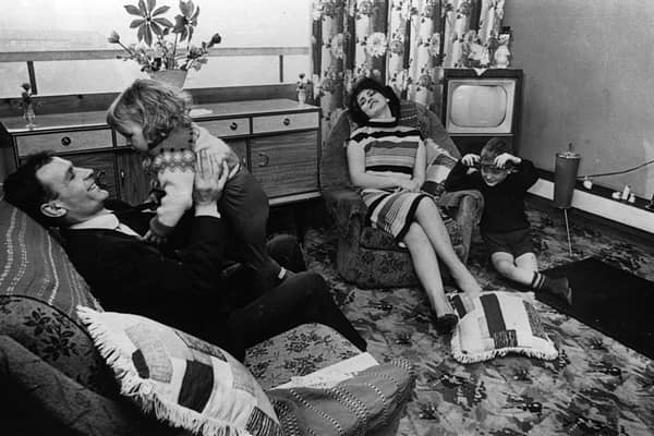 The Buchanan family pictured at home in their new flat in the Gorbals area of Glasgow.(Photo by Albert McCabe/Hulton Archive/Getty Images)