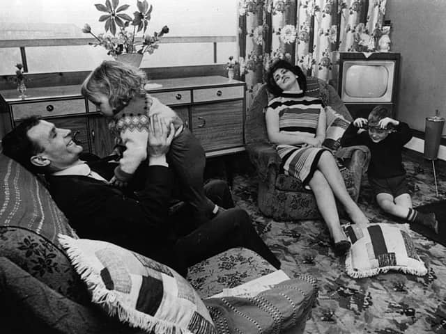 The Buchanan family pictured at home in their new flat in the Gorbals area of Glasgow.(Photo by Albert McCabe/Hulton Archive/Getty Images)