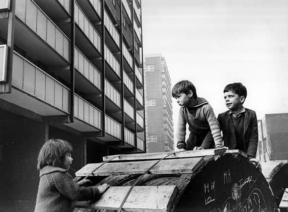 Children playing around the newly built tower blocks in the Gorbals (Photo by Albert McCabe/Express/Getty Images)