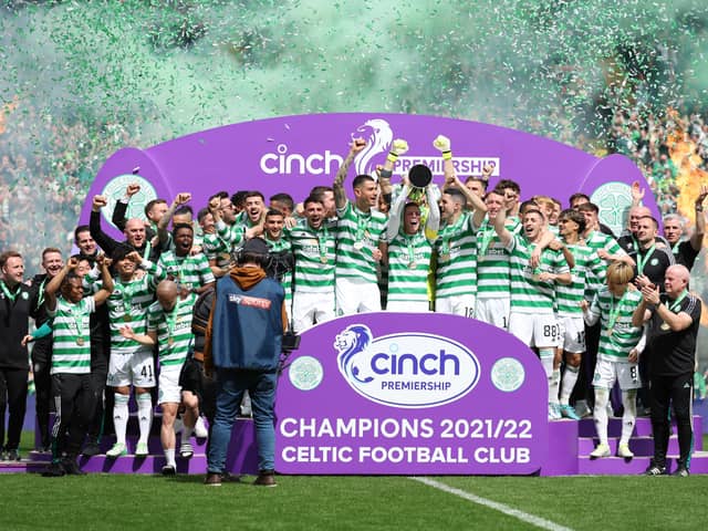Celtic captain Callum McGregor is seen with the Cinch Premier League Trophy 