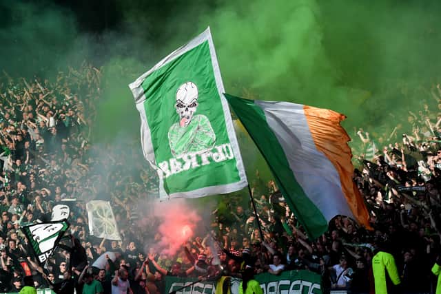 Celtic fans celebrate with flags, flares and smoke bombs during the Viaplay Cup Final against Rangers