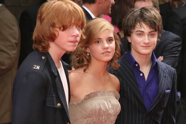 Actor Rupert Grint, Actress Emma Watson, and Actor Daniele Radcliffe attend the Premiere of Harry Potter (Thos Robinson/Getty Images)