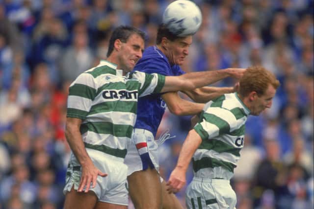 Richard Gough of Rangers (centre) competes for the ball with Mick McCarthy (left) and Tommy Burns of Celtic