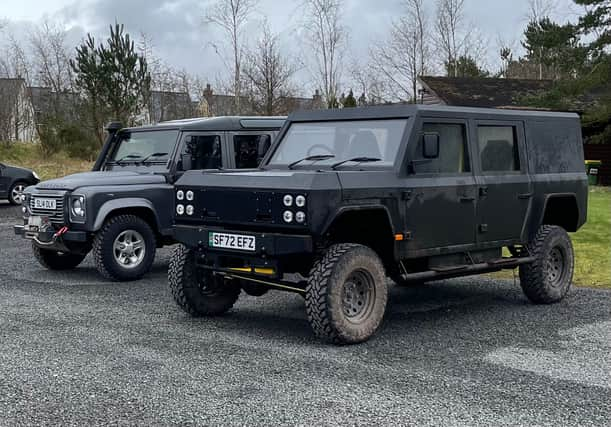 Munro EV, pictured beside a mid-teens Land Rover Defender at Gleneagles Estate