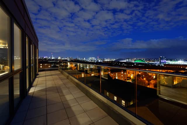 The penthouse balcony offers breath-taking views of the city