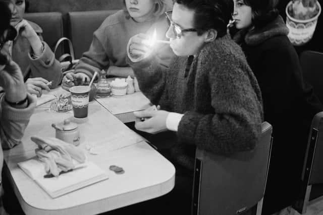 A teenage boy lighting a cigarette in a Wimpy Bar in London in 1960(Photo by Evening Standard/Hulton Archive/Getty Images)