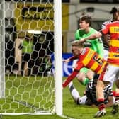Jack McMillan (right) celebrates after Kyle Turner opens the scoring for Partick Thistle.