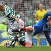 Daizen Maeda of Celtic vies with John Lundstram of Rangers