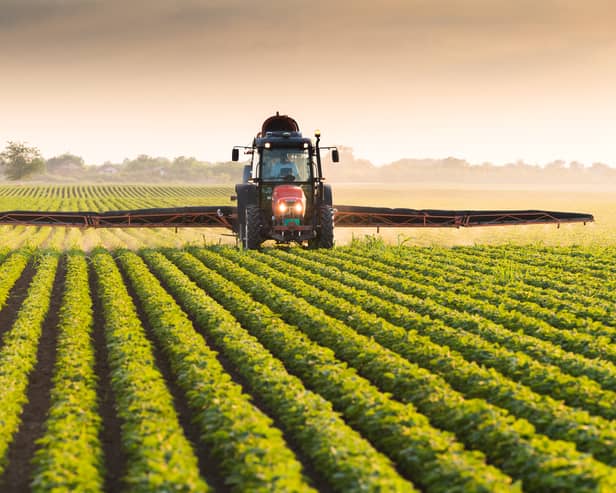 A toddler died after being hit by a tractor in Devon