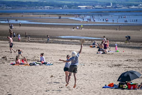 The Met Office has released weather forecasts for the UK, with temperatures likely to hit 21°C. (Photo by Jeff J Mitchell/Getty Images)